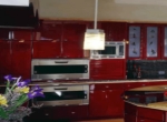Угловая красная кухня премиум класса, до потолка